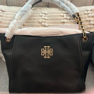 Tory Burch purse. Brand new in black with gold hardware. New with tag.